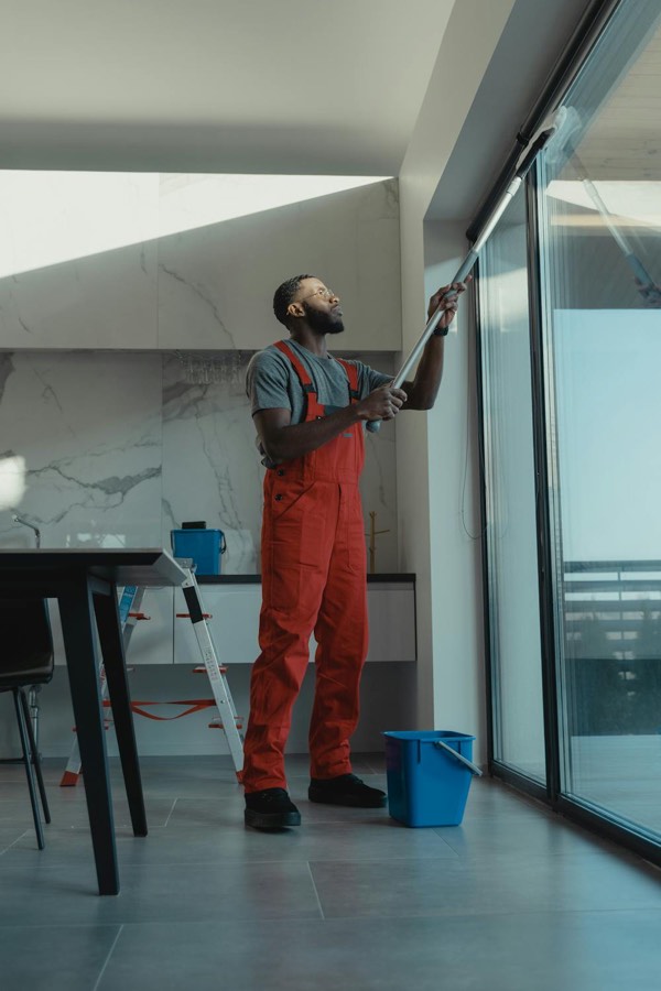 Professional cleaner working in a modern commercial interior